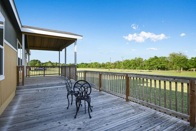 Wooden deck with a lawn | Image 15