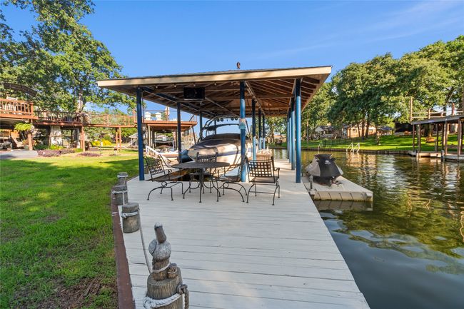 Boathouse with slip, lift and pod for 2 personal water craft. Water craft comes with trailers available separately | Image 27