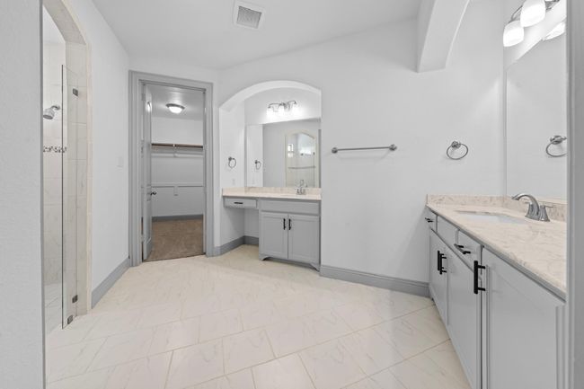 Full bathroom with visible vents, marble finish floor, a stall shower, and a sink | Image 14