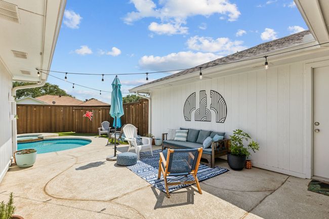 View of patio / terrace with outdoor lounge area and a pool with connected hot tub | Image 24