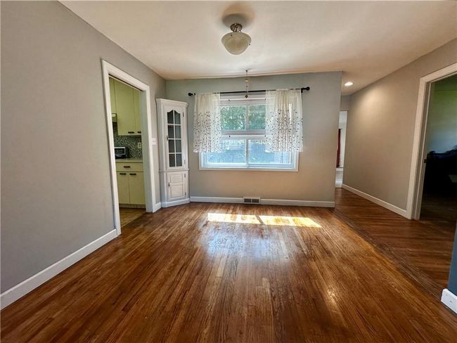 Unfurnished room with hardwood / wood-style flooring | Image 9