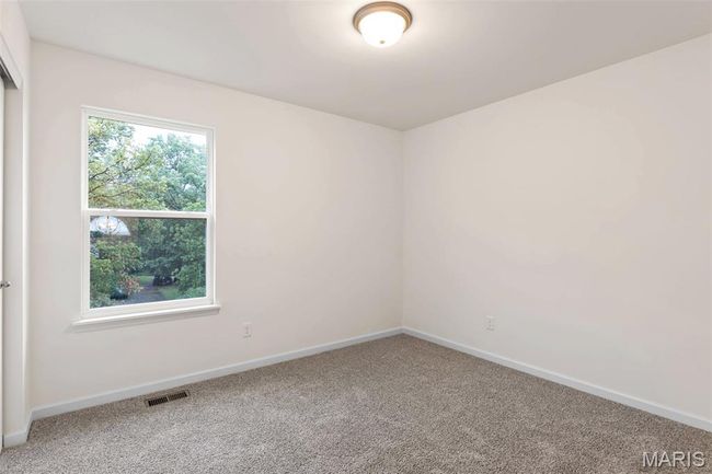 Carpeted empty room featuring baseboards | Image 19