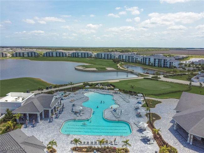 Aerial view of a nearby body of water, a pool area, and a golf club | Image 41
