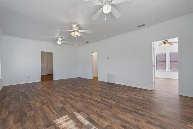 Spare room with crown molding and dark hardwood / wood-style floors | Image 7