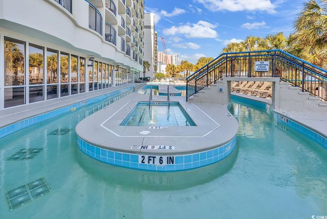 Community pool with a hot tub and stairs | Image 20