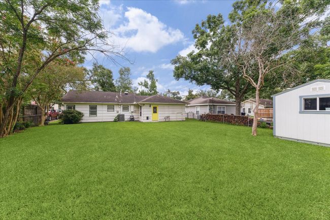 Incredible backyard with room for a pool, nice area for children, pets, and entertaining friends. Lovely mature trees provide nice shade. Storage shed for lawn tools. | Image 10