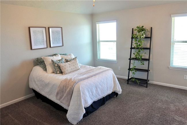 Bedroom with carpet floors and baseboards | Image 10