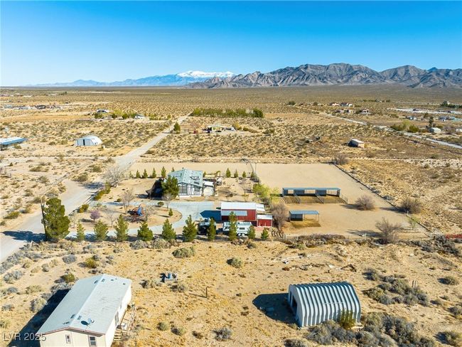 Birds eye view of property featuring a mountain view, a rural view, and view of desert | Image 87