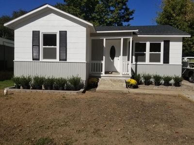 Beautiful little doll house TOTALLY renovated. New roof, plumbing, walls, baths, floors, windows and more! | Image 1