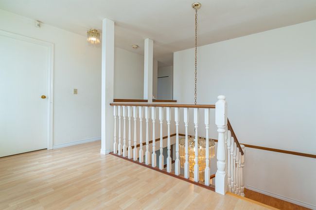 Stairway with wood finished floors and baseboards | Image 21