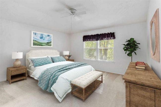 **Virtually stage** Primary Bedroom featuring light carpet, baseboards, and ceiling fan | Image 22