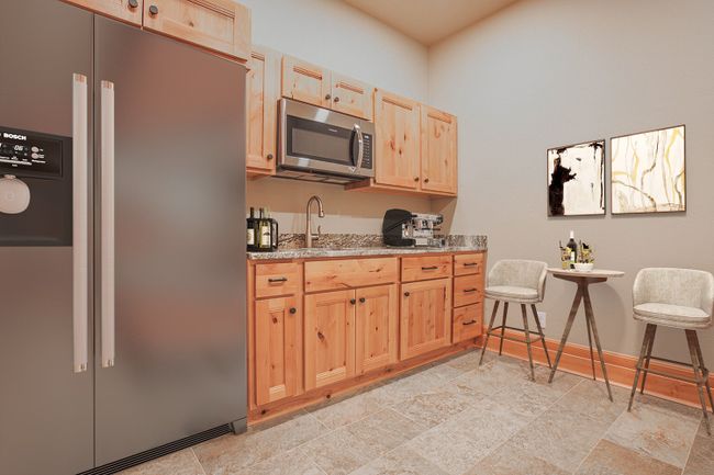 kitchen in basement- digitally staged, refrigerator not included. | Image 63
