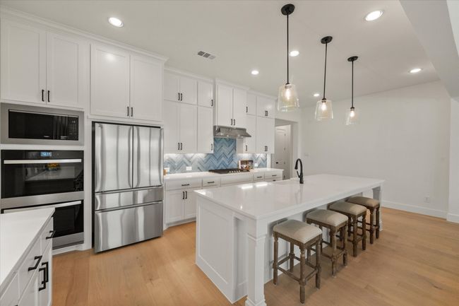 Double ovens and gas range make a chef's dream kitchen | Image 7