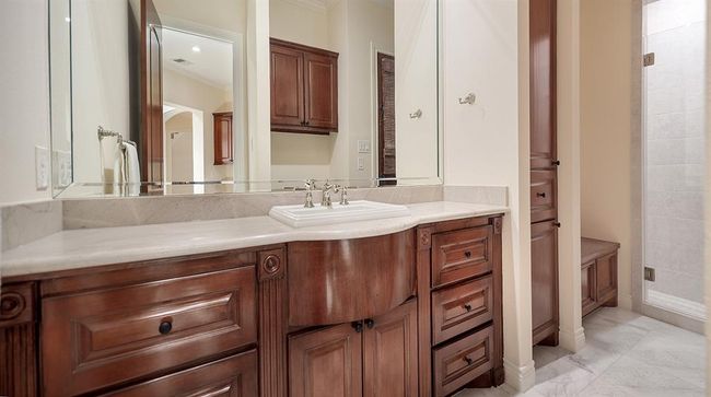 This full pool bath opens to the patio, and is also conveniently located by the garage | Image 18