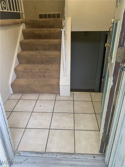 Staircase featuring tile patterned floors | Image 2