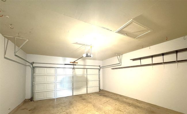 Garage featuring a garage door opener | Image 15