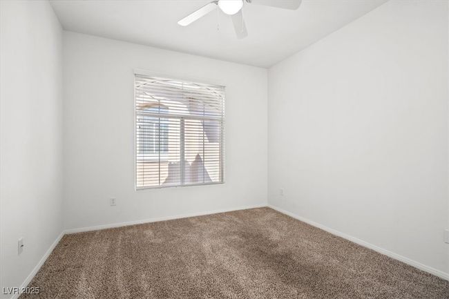Empty room with baseboards, a ceiling fan, and carpet | Image 11