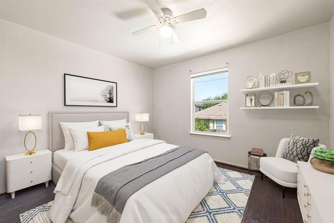 Bright and airy secondary bedroom with large windows, neutral tones, and tile flooring perfect for guests or a growing family. *Virtually Staged | Image 14
