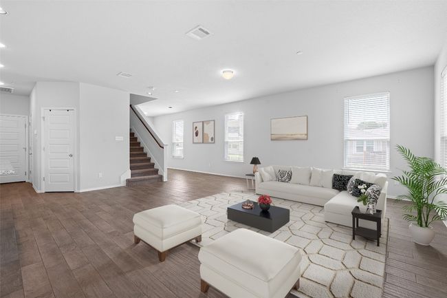 Living area with stairway, wood finished floors, and recessed lighting | Image 6