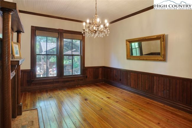 Dining room with fireplace looking out on gazebo area | Image 15