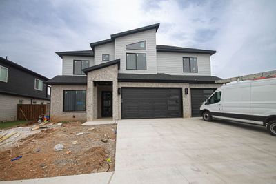 This stunning modern exterior home is nestled in the upscale community of Aurora, offering an array of amenities that epitomize luxury living. | Image 1