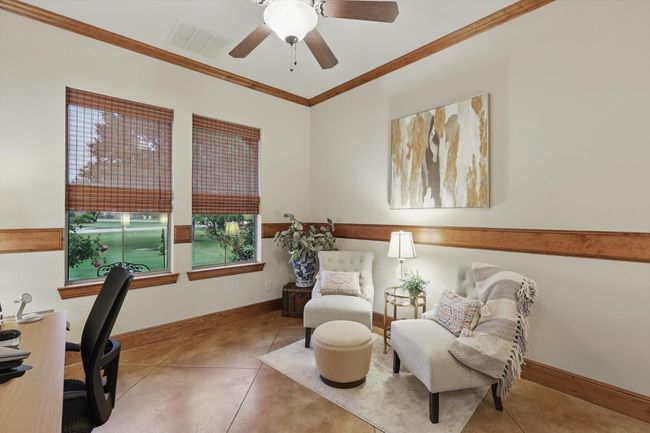 Home office featuring ornamental molding, tile patterned flooring, and a ceiling fan | Image 7