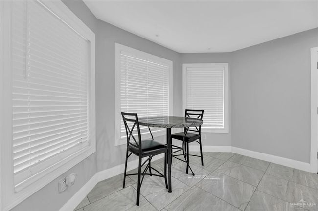 good size dining area with view to the outsie | Image 6