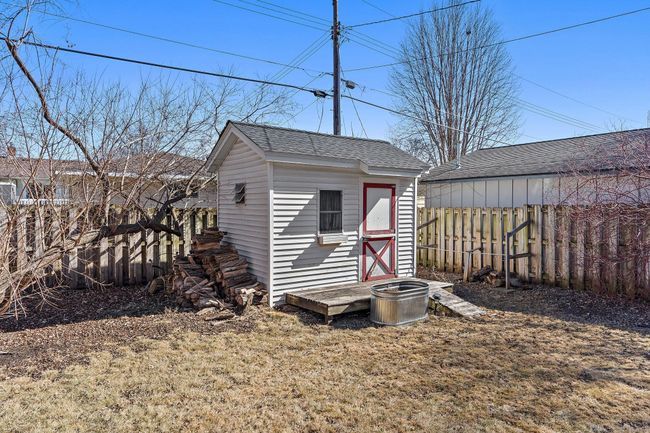 The small yard shed is perfect for storing garden tools and furniture. | Image 30
