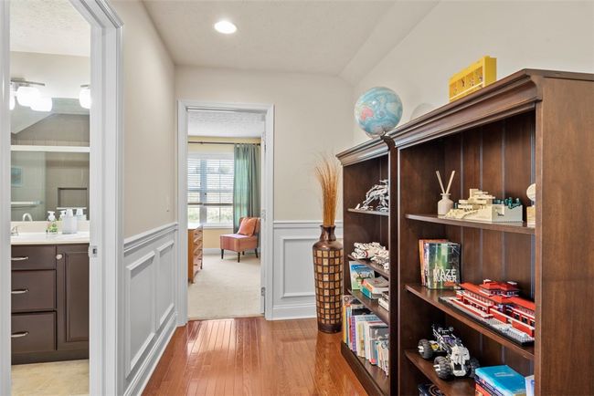A hallway bump out allows space for a chair and table or bookshelves | Image 33