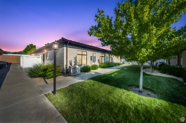 View of front of property featuring a cooling unit and brick siding | Image 16