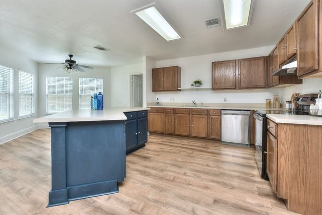 Abundant cabinets and countertop space add to the functionality of this kitchen! | Image 16