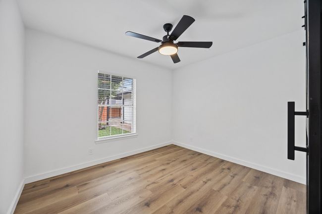 Spare room with wood finished floors and ceiling fan | Image 22