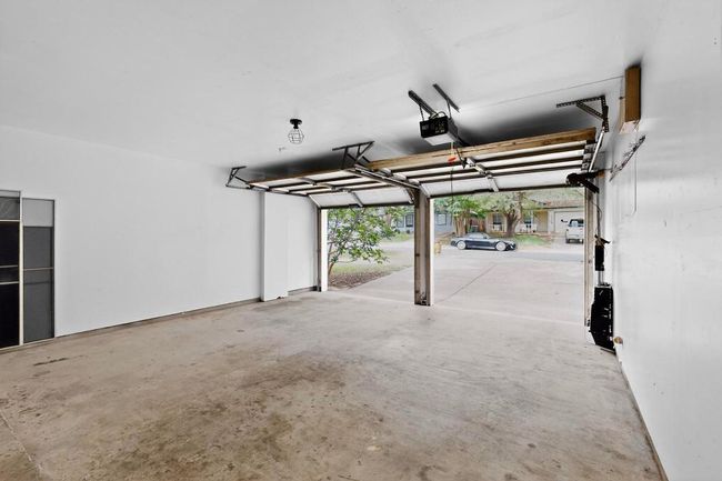 Garage with a garage door opener | Image 27