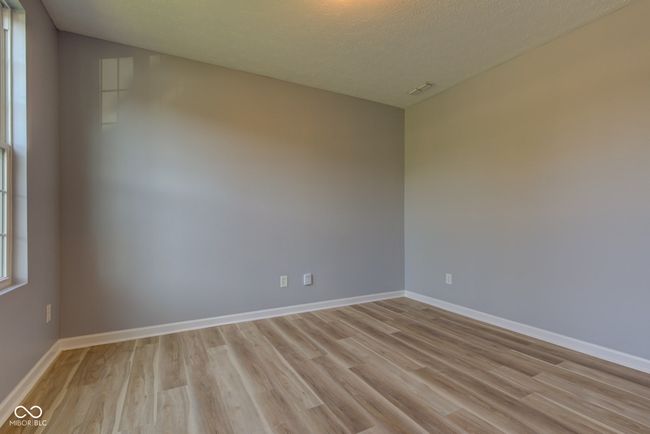 spare room featuring light wood-type flooring and baseboards | Image 16