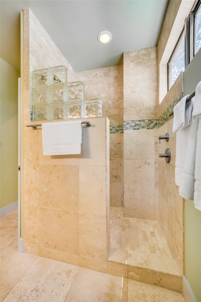 Bathroom featuring tiled shower | Image 17