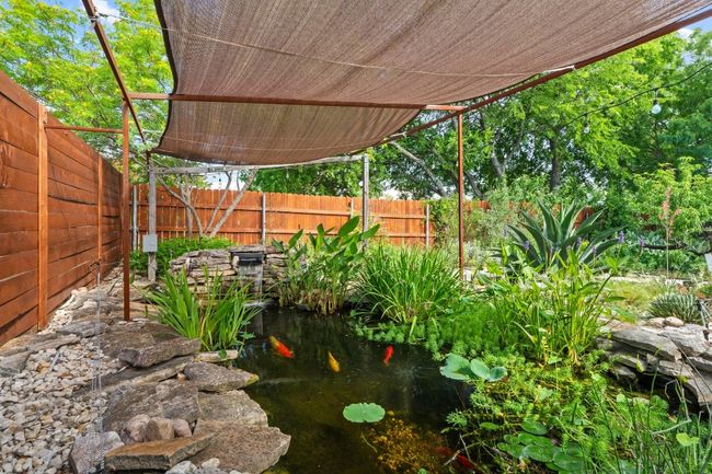 The koi pond is a stunning addition where you will hear toads chirping in the evening, birds having a nice drink of water on a hot summer's day, and more. | Image 12