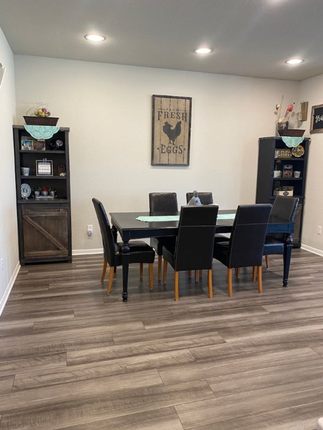 Dining room with recessed lighting, baseboards, and wood finished floors | Image 6
