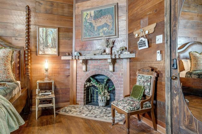 Keaton's Lodge has an elegant rustic vibe with fireplace, exposed original wooden planks on walls that serve as the perfect canvas for art displays | Image 27