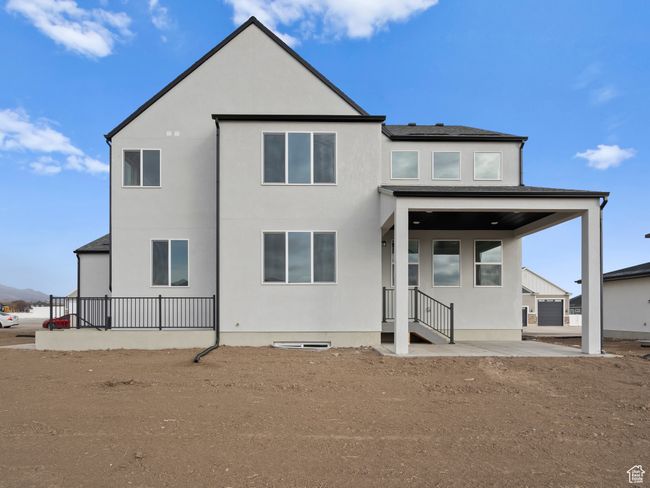 Rear view of property featuring stucco siding | Image 25