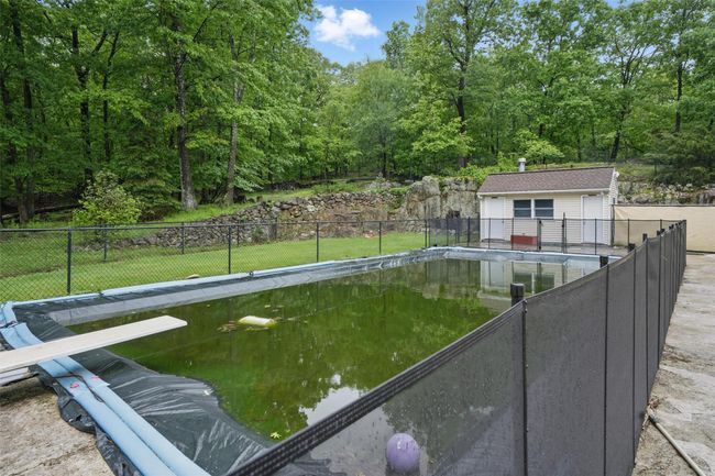 View of pool with an outdoor structure | Image 45