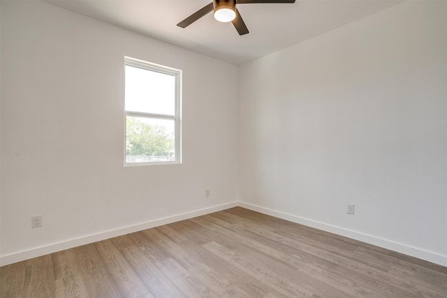 Unfurnished room featuring baseboards, wood finished floors, and ceiling fan | Image 24