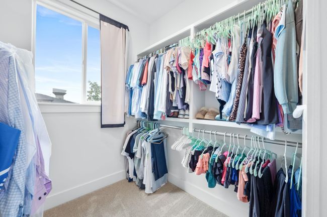 Spacious closet featuring carpet floors | Image 19