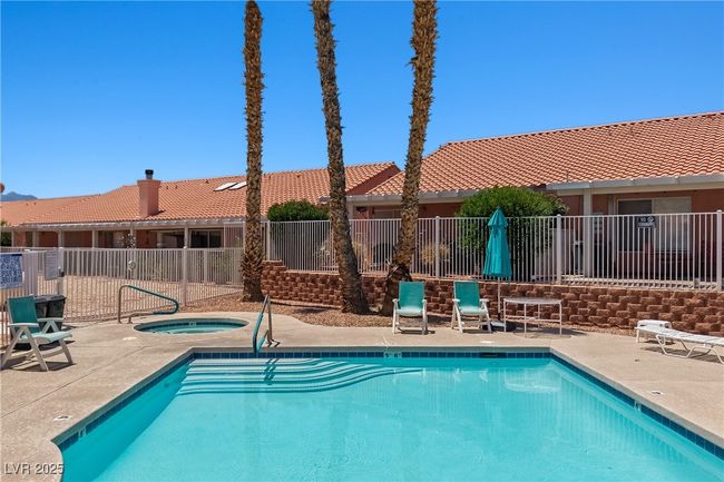Community pool with a hot tub and a patio area | Image 34
