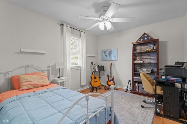 bedroom featuring light wood-style floors, and ceiling fan | Image 24