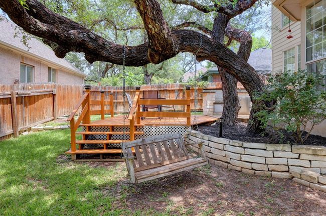 Fenced backyard featuring a wooden deck | Image 35