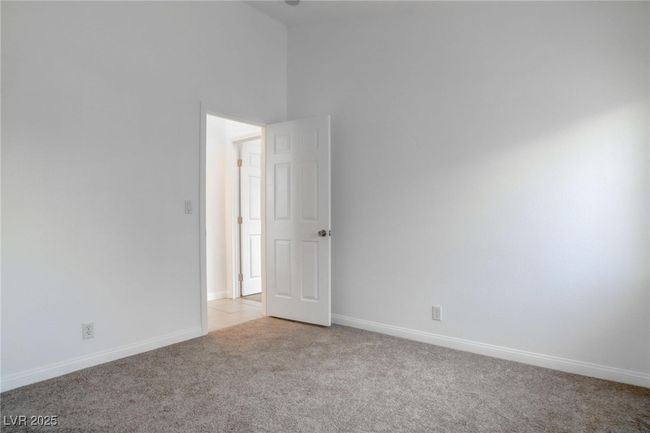 Bedroom with lofted ceiling, & a closet | Image 26