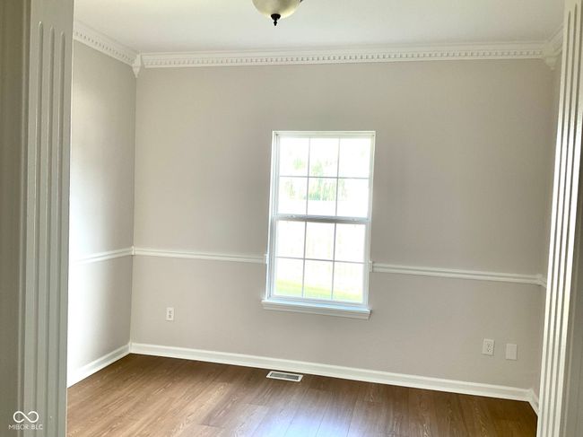 Dining room or multi purpose space with new paint and flooring. | Image 7