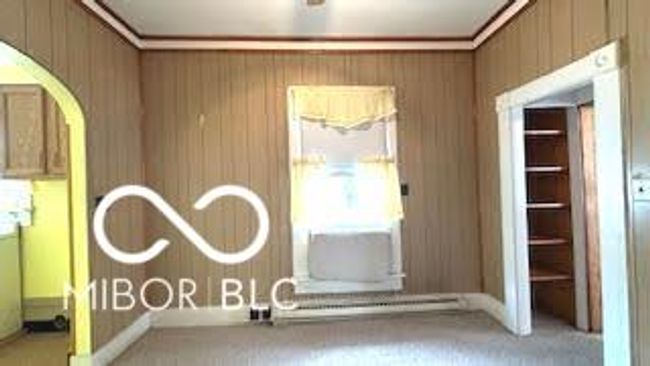 arched door ways, carpet flooring, built in shelving | Image 8