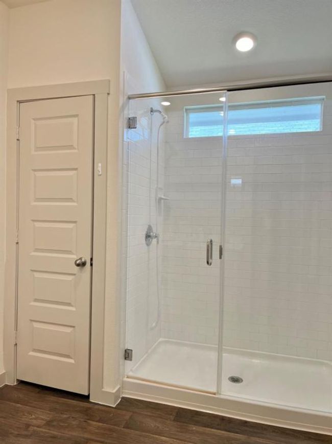 Full bathroom featuring a shower stall and wood finished floors | Image 17