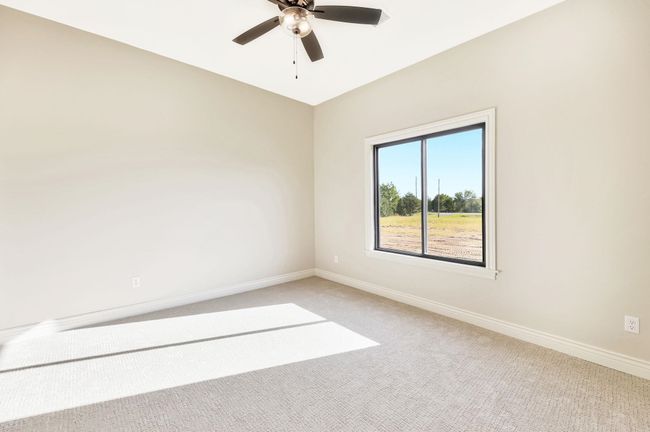 Empty room with carpet flooring and ceiling fan | Image 31